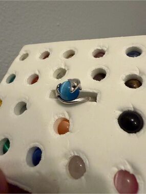 Dolphin ring with interchangeable stones
